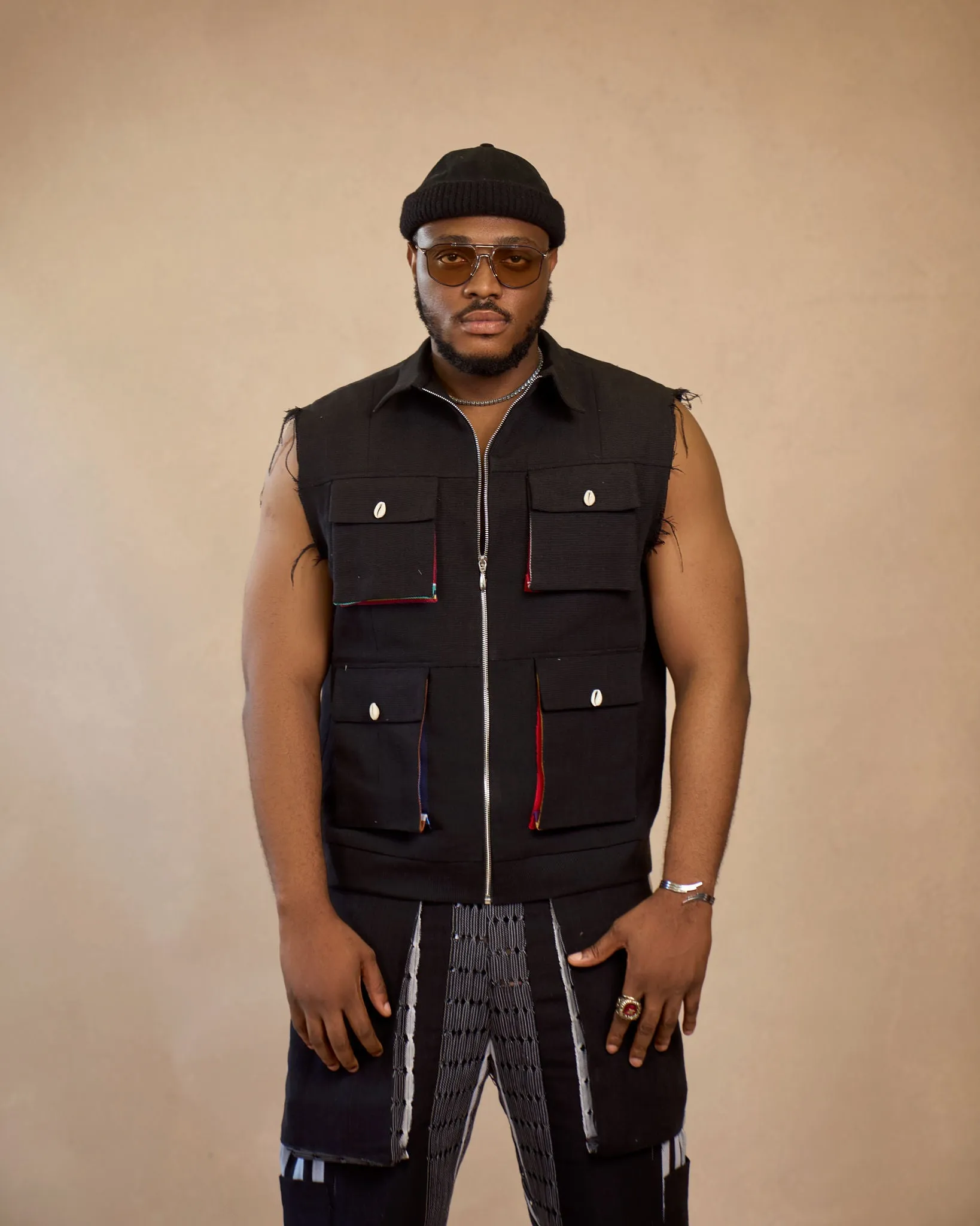 Aso oke sleeveless jacket and patch cargo pant