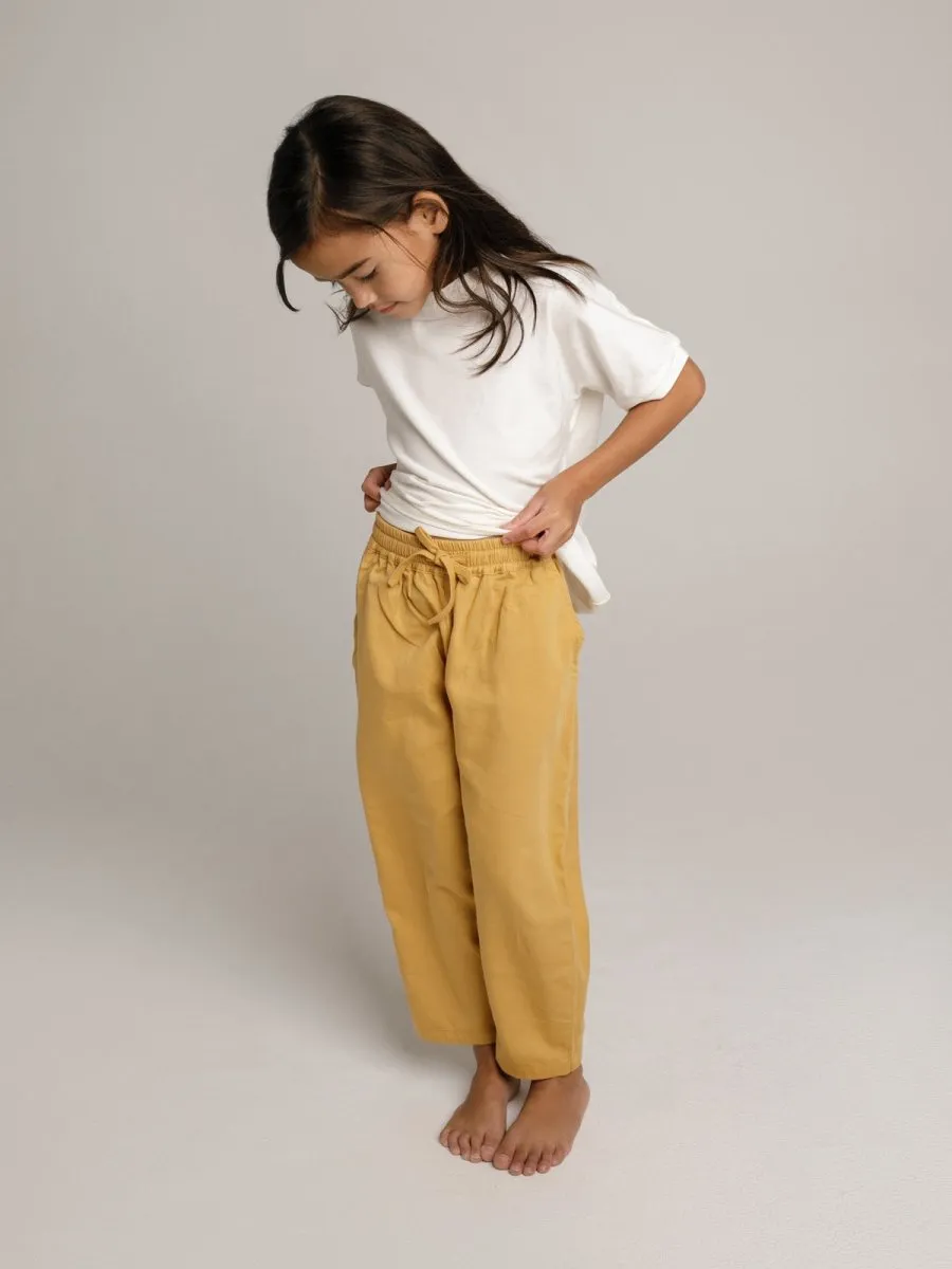 Unisex children organic pants in yellow